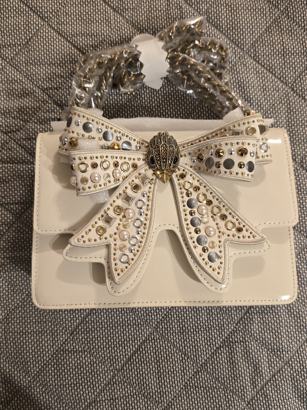 Kurt Geiger Cream Patent Small Bow Shoulder Bag with Gold Studs